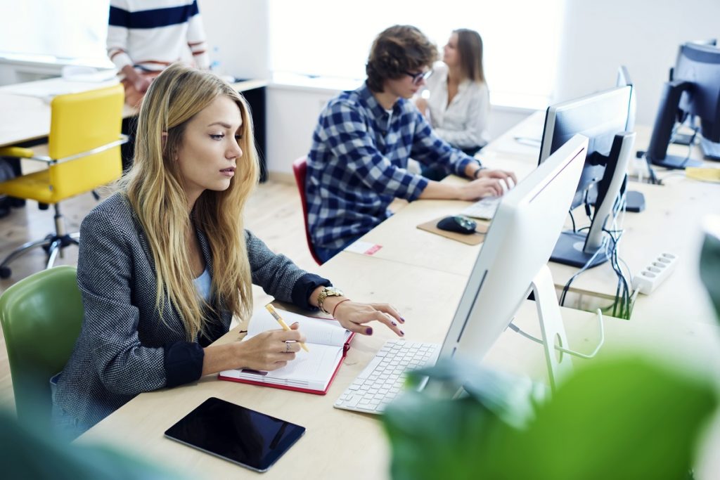 Female employee taking down notes