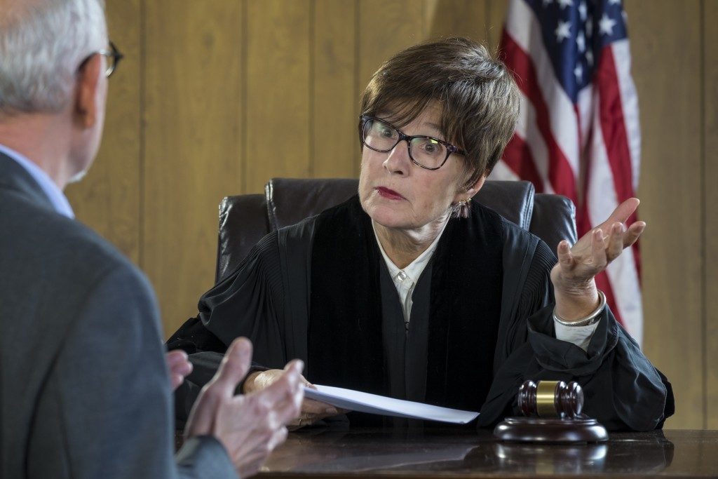 Judge talkling with a businessman