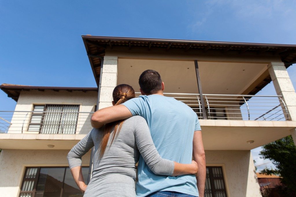 Couple looking at their new house