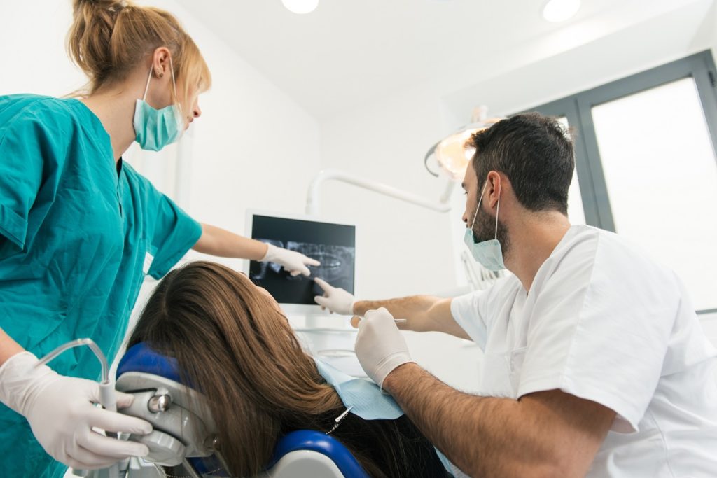 Dentists with patient