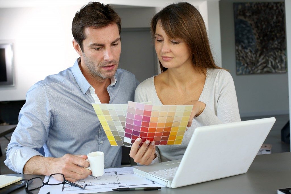 man and woman picking a color swatch