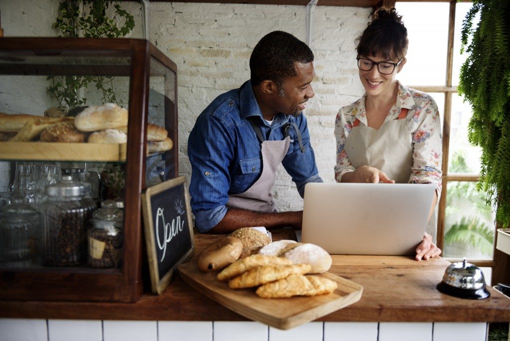 Couple managing their cafe