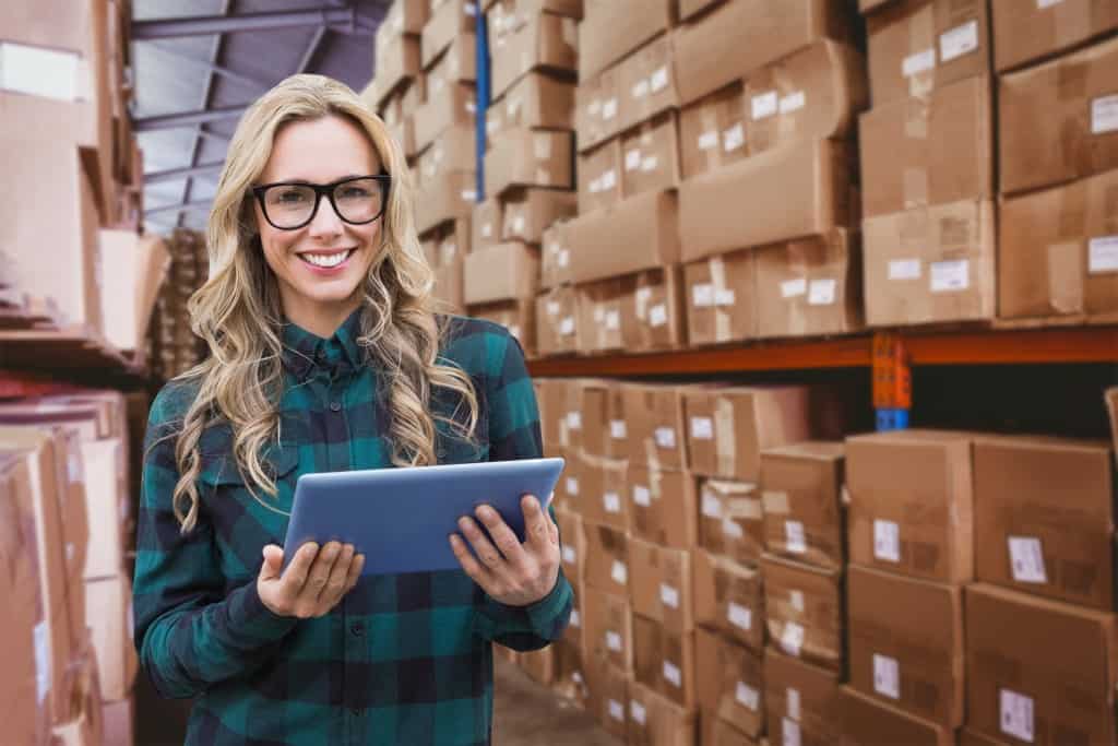 Women in warehouse of packages