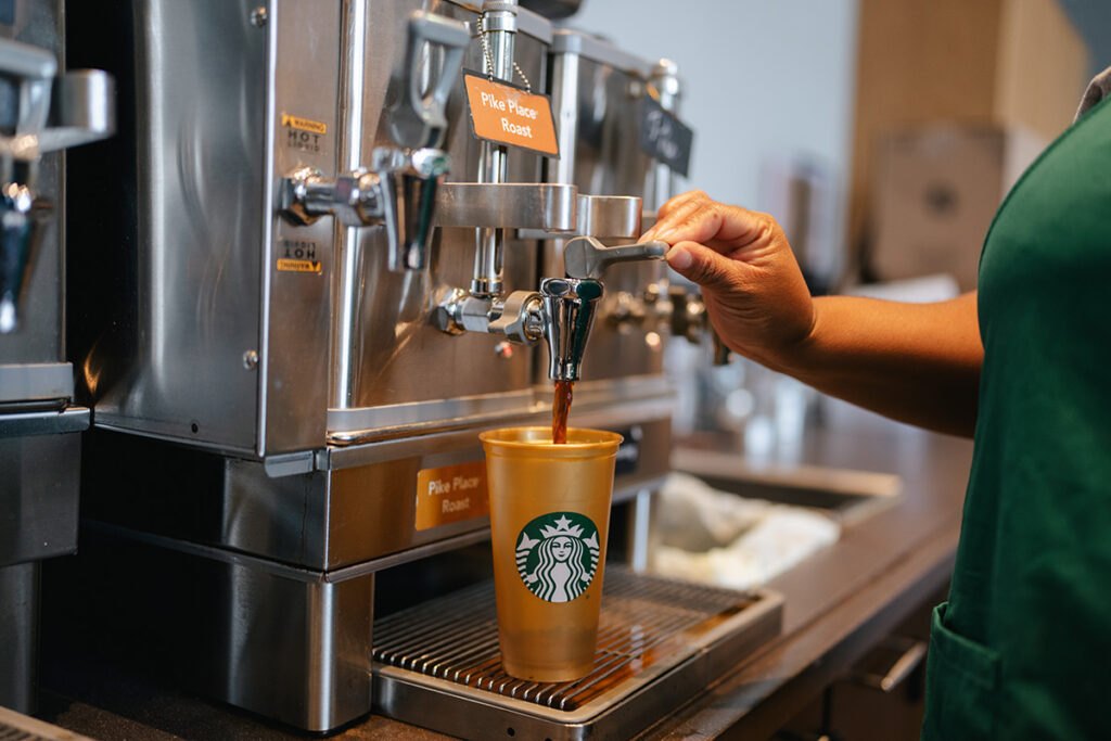 Cropped person preparing a coffee