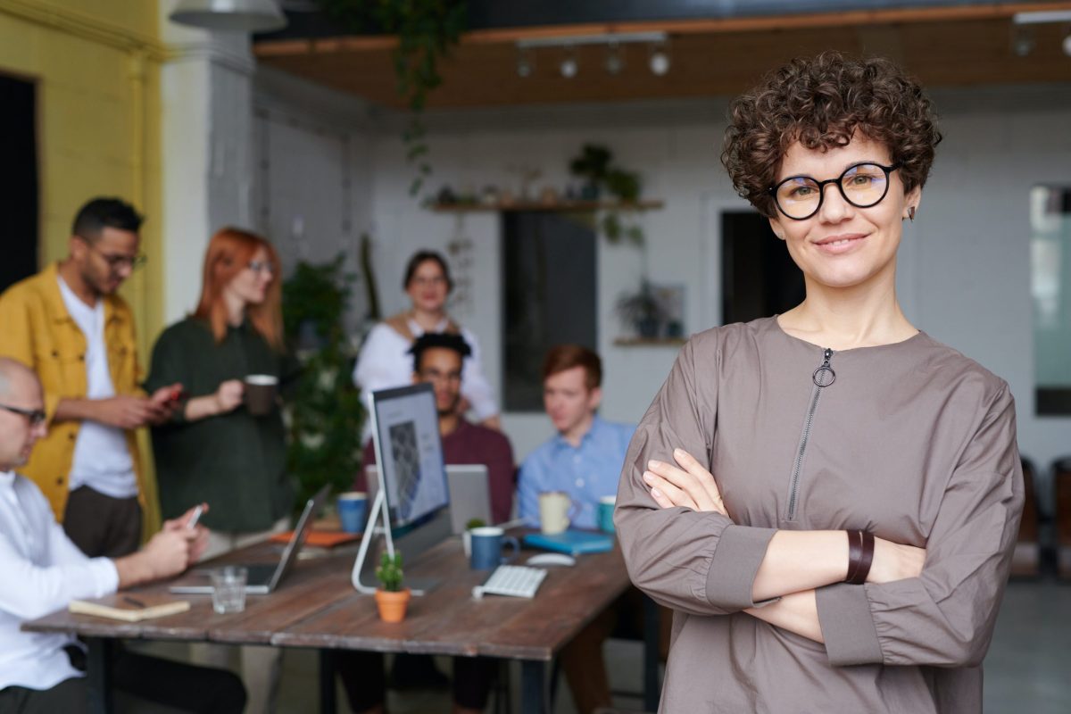Woman happy with employees discussing