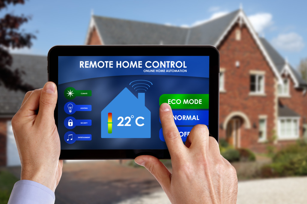 smart home being controlled by app on a tablet